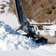 Planica neprepoznavna - ni snega, a delavci ... (foto). Pa še snemanje filmskega trilerja