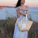 7 ključnih trendov poletnih oblek: od romantičnih rokavov do elegantnih bandeau krojev