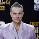 Robbie Williams z novim albumom podrl rekord Beatlesov