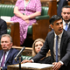 Britanski parlament sprejel sporen migracijski zakon